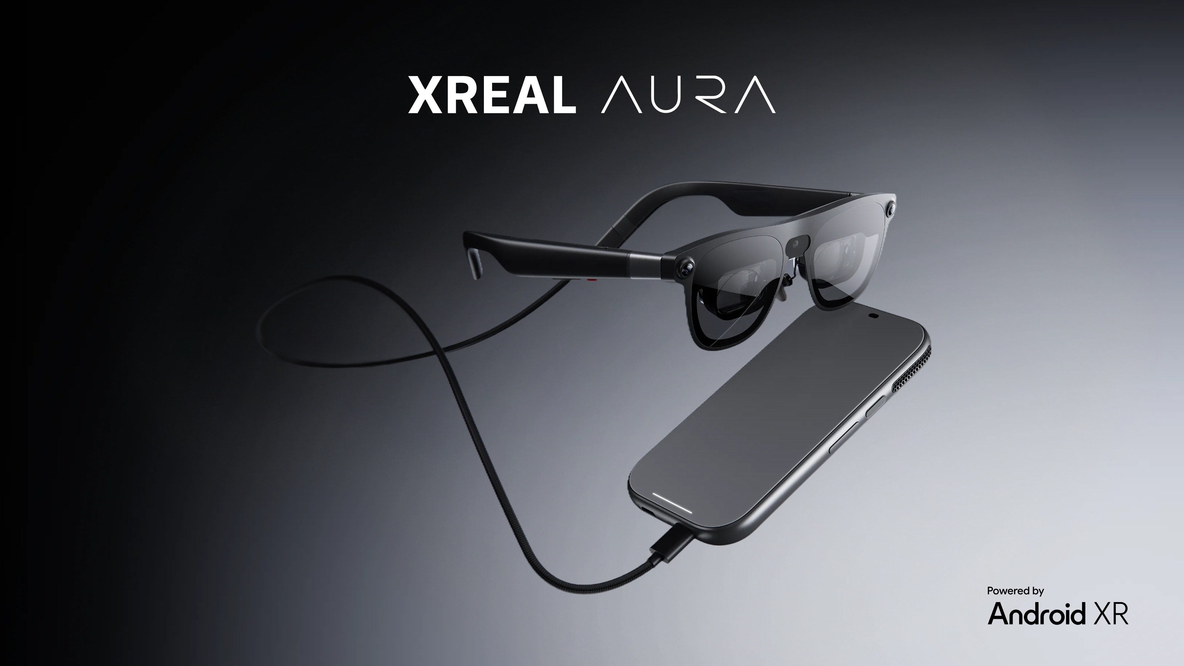 Xreal abriu oficialmente as pré-vendas do Aura, o primeiro par de óculos com a plataforma Android XR do Google. Equipado com processadores Snapdragon da Qualcomm e recursos de IA Gemini, o Aura promete uma tela espacial de 1200p a 120Hz com campo de visão de 70 graus em uma armação de apenas 95 gramas.

O Aura suporta espelhamento com fio para PCs e consoles, roda aplicativos móveis do Google Play e chega com mais de 150 experiências feitas para XR, incluindo jogos baseados em Fallout e Project Hail Mary. A Xreal também está trabalhando com a GameSir em um controle dedicado com tecla Gemini.

As pré-vendas estão abertas nos EUA, Canadá, Japão e Coreia do Sul. O modelo de 12GB+256GB custa US$ 1.279, enquanto o de 16GB+512GB sai por US$ 1.499, mas os primeiros compradores podem economizar até dezembro de 2026. O envio começa em meados de novembro. É um passo ousado e caro rumo à computação espacial mainstream, e o preço será o maior debate.
