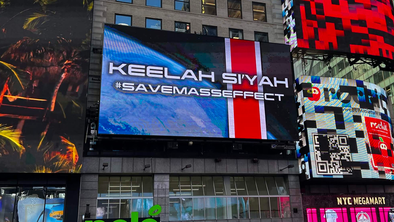 Os fãs de Mass Effect transformaram a frustração em ação. Depois que a EA fechou a BioWare e colocou o futuro da série de RPG sci-fi em risco, a comunidade colocou um outdoor #SaveMassEffect na Times Square, em Nova York, com uma mensagem em khelish e uma exigência clara: essa franquia e as pessoas que a criam merecem mais respeito.

O outdoor é apenas o primeiro passo. Organizadores dizem que mais campanhas estão por vir, incluindo peças mais simples e códigos QR que levam à petição, em uma reação direta a uma decisão corporativa que tratou um dos estúdios mais queridos da indústria como algo descartável. É um lembrete poderoso de que jogos são arte, e os desenvolvedores por trás deles merecem estabilidade, dignidade e voz sobre o próprio futuro.

Com fãs financiando outdoors e se organizando entre países, o #SaveMassEffect mostra como a pressão da comunidade pode confrontar a lógica de fechamentos e demissões em massa movidas apenas por lucro.